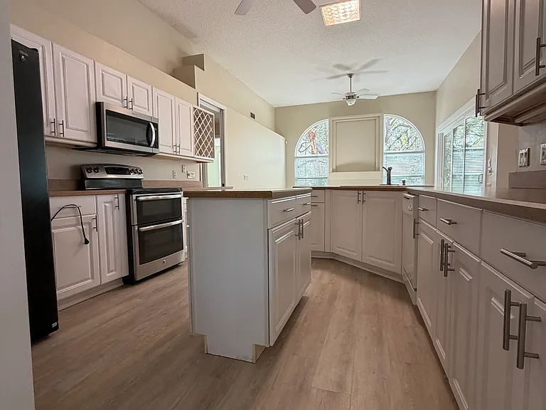 Kitchen, has built in Pantry & entrance to indoor laundry & 2 car garage.