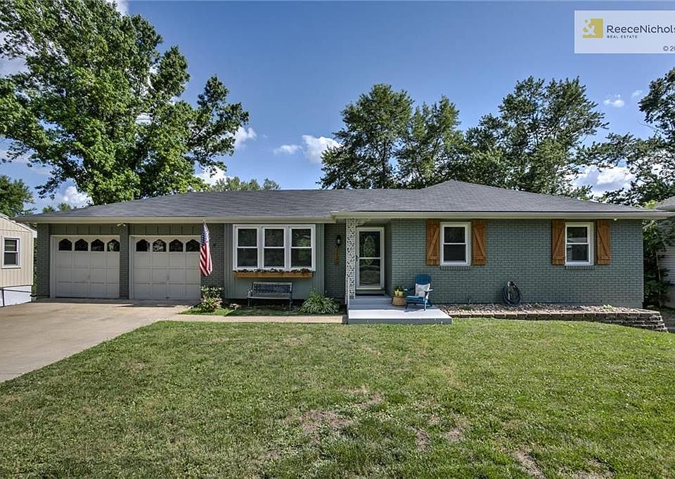 Custom shutters and new Garage doors adorn this well thought out Ranch!