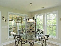 Breakfast room looks out on beautiful wooded green space
