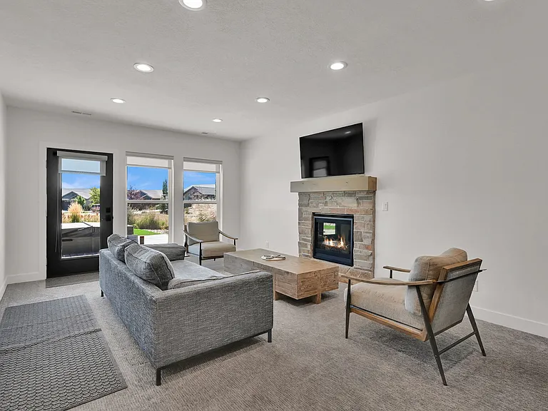 Downstairs living room with gas fireplace and smart tv
Walk out access to back patio and private hot tub
