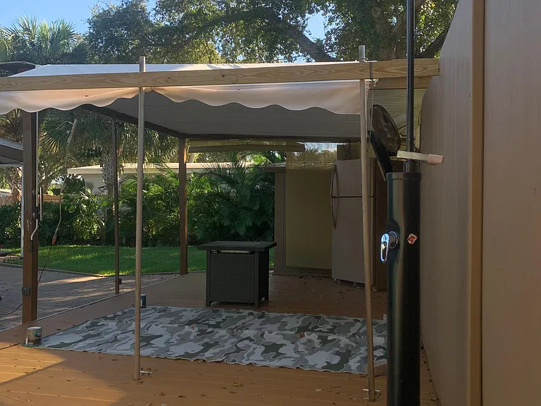 outdoor shower area and covered patio
