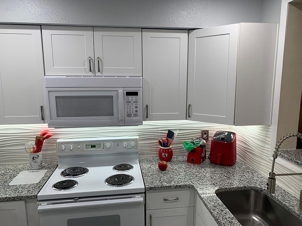 New granite countertop, new stainless sink, faucet, cabinets, and up and down lighting.