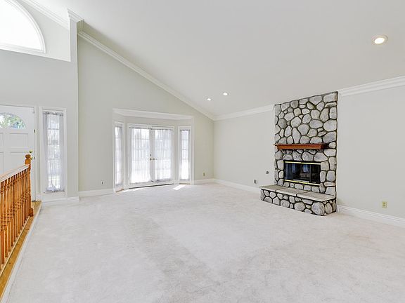 Bright and spacious living room with soon brand new carpet!