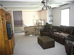 Large living room w/new carpet and padding throughout entire home. Fireplace
