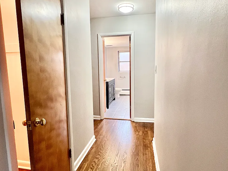 Hallway from the living room into the coat closet