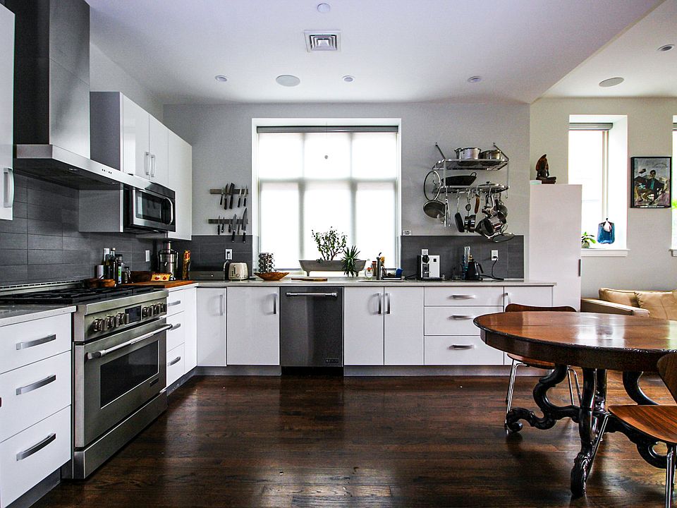 Kitchen with modern appliances and quartz countertops