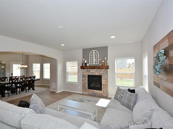 Open space living room / dining room with fireplace leads to fenced in yard. source: Pikes Peak Multiple Listing Service from prior sale of home