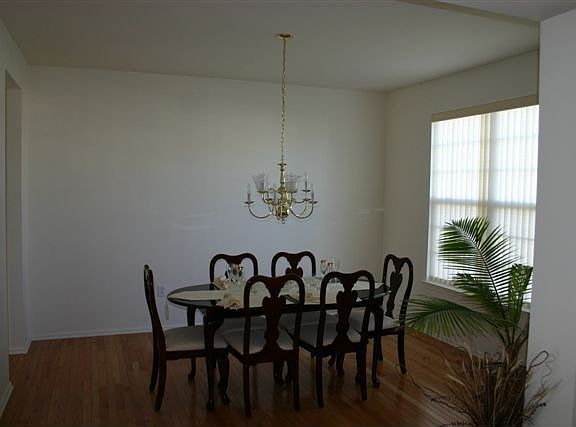 Formal dining room with wood floors throughout first floor 