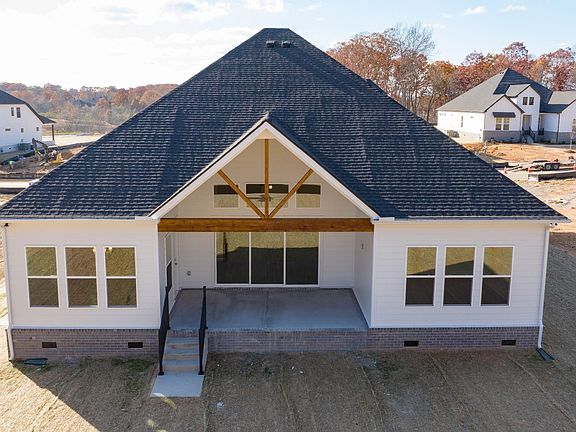 Rear of home with covered back patio