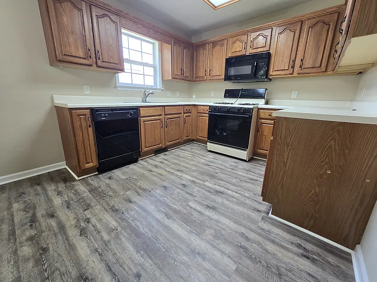 Kitchen with new deep single sink and pull out hose, new stove and refrigerator scheduled
