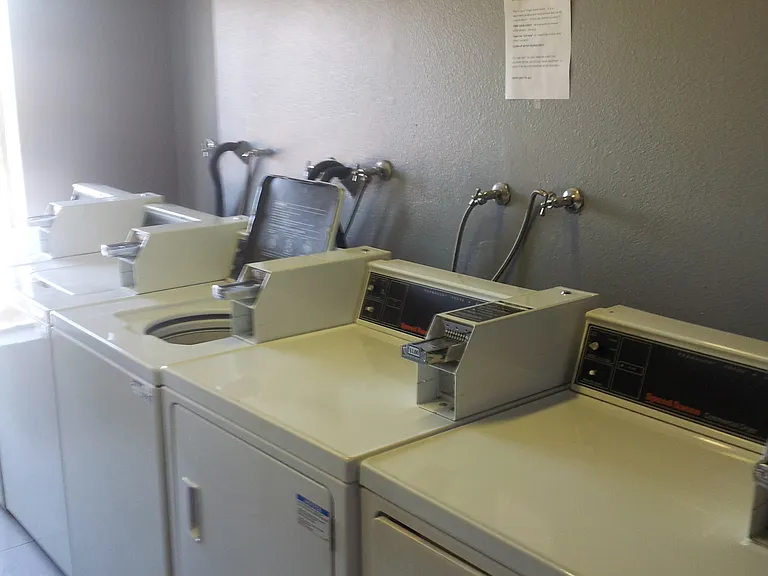 Laundry room coin washer/dryers
