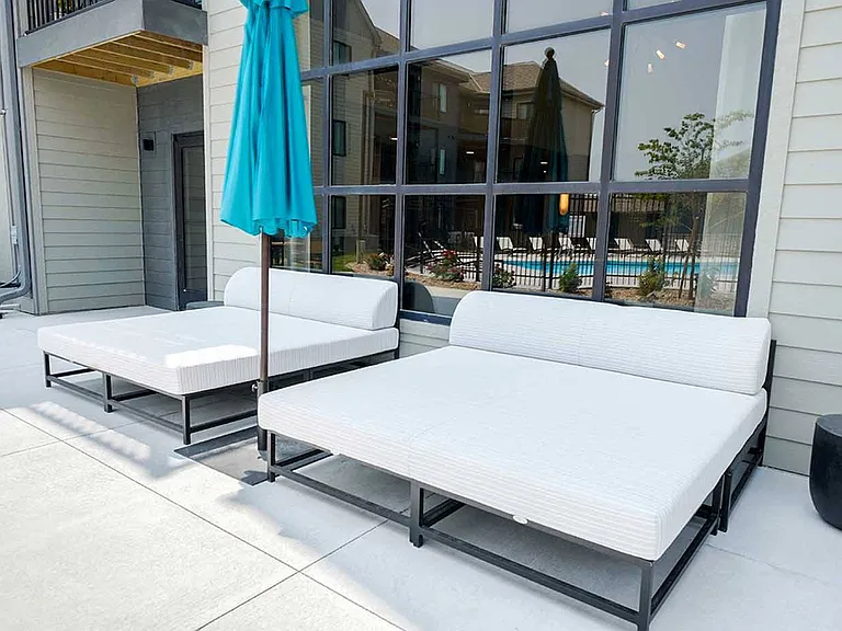 Find your sanctuary with our luxurious outdoor daybeds by the clubhouse, perfect for soaking up the sun or enjoying a peaceful afternoon.