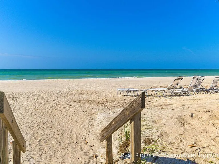 5135 Gulf Of Mexico Dr #103 — Photo 1