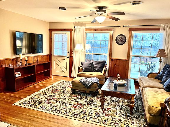 Living Room and front door with views of hills and neighborhood