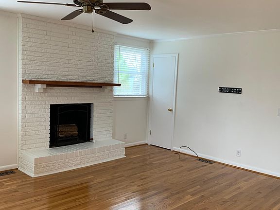 Den off of kitchen open and airy, overlooking backyard. Fireplace does not work.