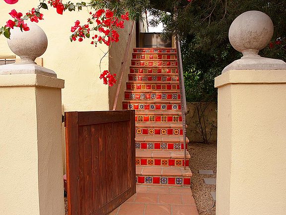 Front Gate side yard seating area and back yard entrance