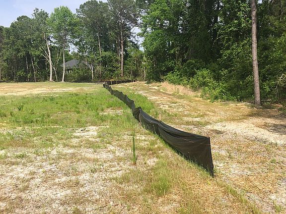 Along rear property line