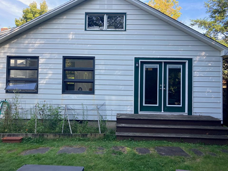 french doors lead from living room to front yard