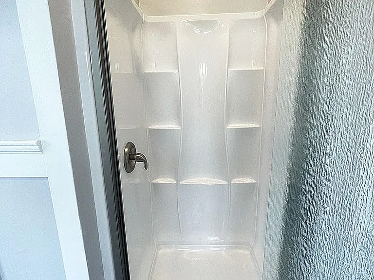 Master bedroom with Shower, Toilet, and AC unit!