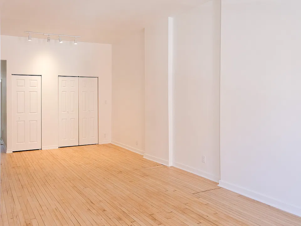 Living Room with laundry & coat closets