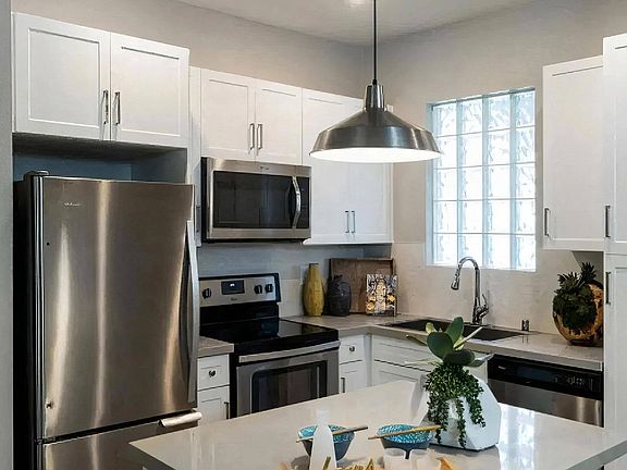 Modern Kitchen with Stainless Steel Appliances and White Cabinetry