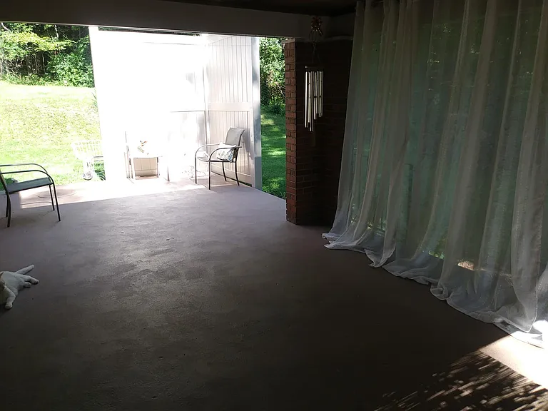 Covered porch looking to patio.