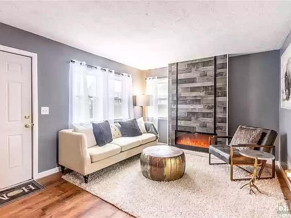 Living room with electric "fireplace". Not shown is a newly installed mantel - great for placing a flatscreen tv on top.