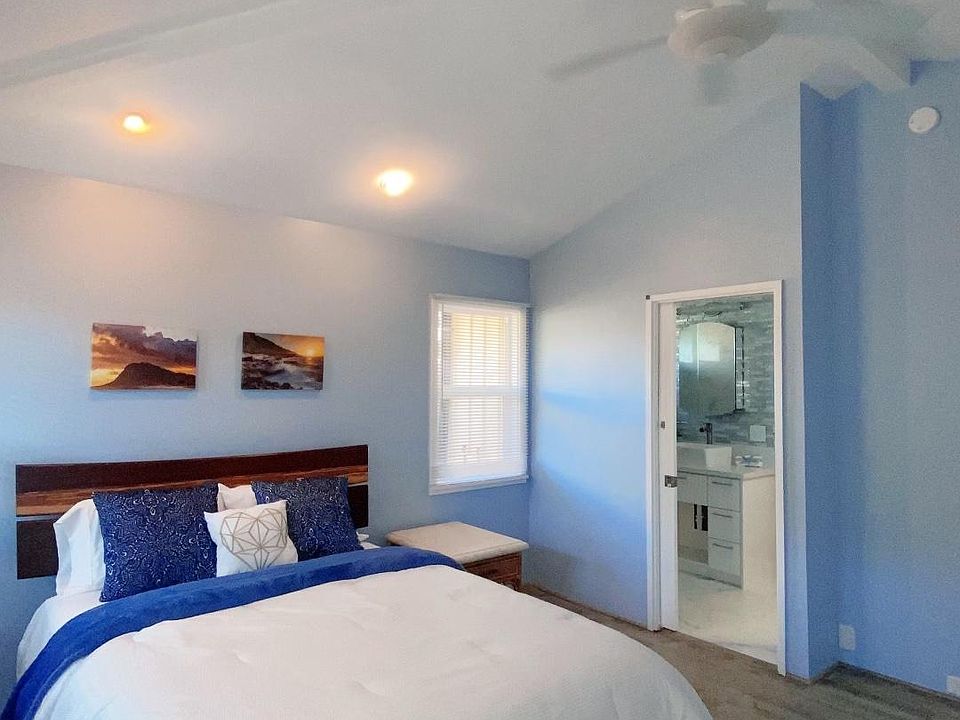 Bed Room: Queen Bed, Hight Ceiling and Ceiling fan in the bed room.