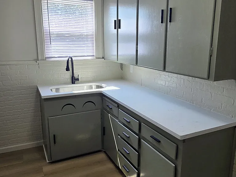 Updated kitchen with new sink and quartz countertops