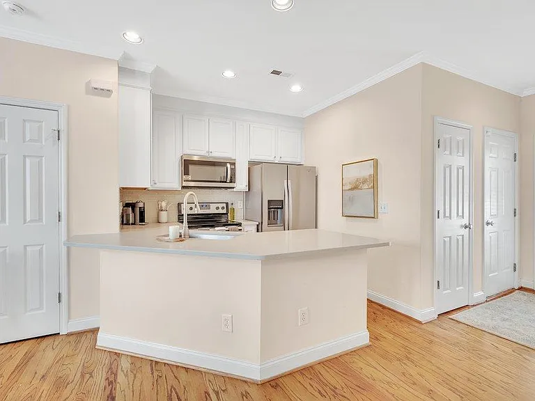 Updated kitchen with quartz counter tops and stainless steel appliances