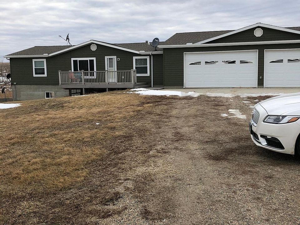 Front of the house with 4 car garage