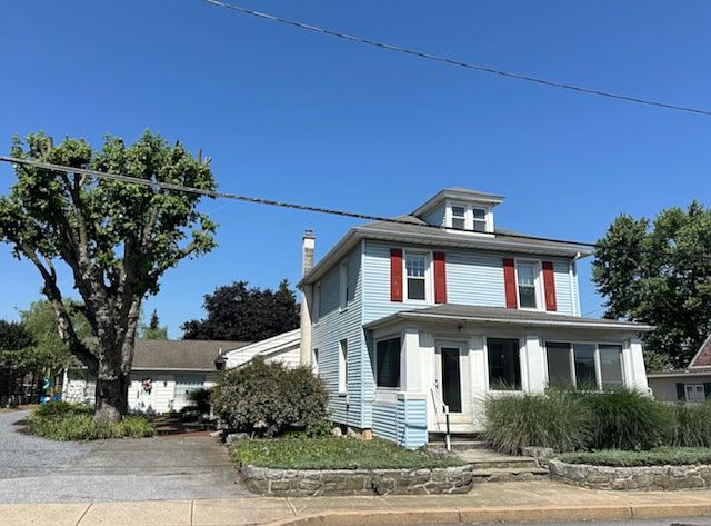 Charming two story house. Sun porch, lots of windows, off street parking, shared courtyard patio space.