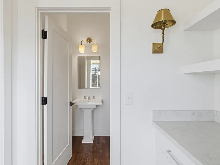 Half bath off the kitchen on the second floor.