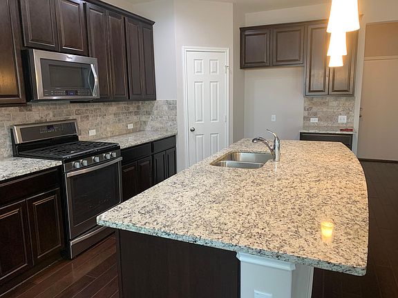 Huge counter height granite covered island!