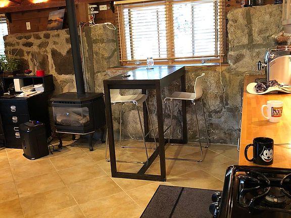 Yes the walls are rock... Kitchen with provided table and chairs