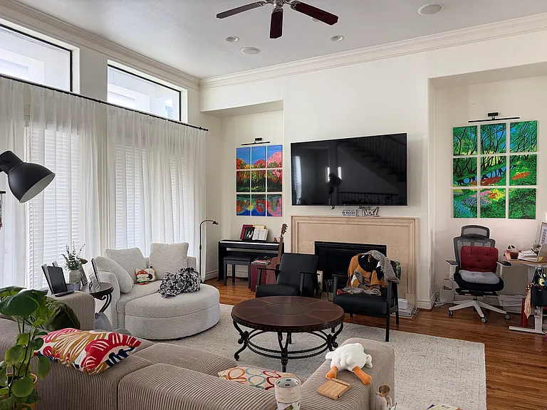 The mounted TV will stay, and the rest of the furniture is not included.