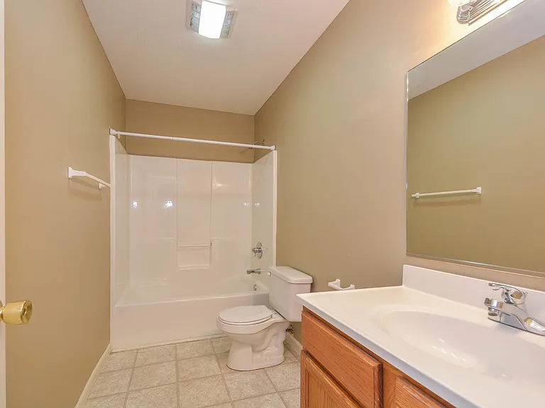 All bathrooms have a more modern vinyl flooring compared to the one depicted in the picture.
