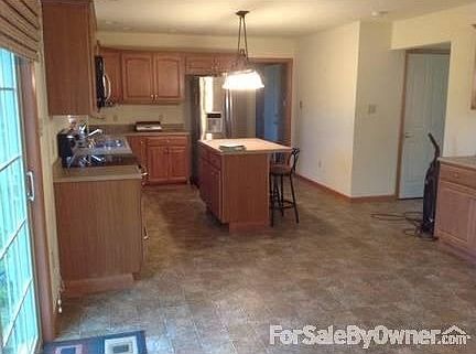 Kitchen : Island seats 2. Pantry & additional cupboards with counter space not shown.