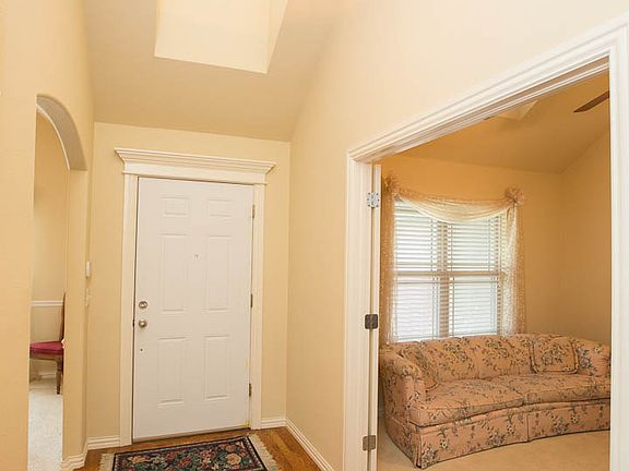 Beautiful entry with natural light and real hardwood flooring