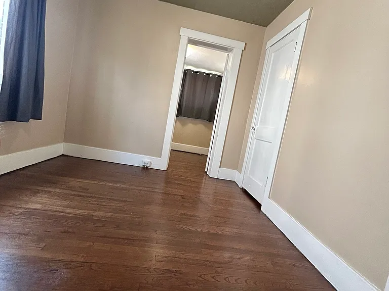 Bedroom with door leading to attached office