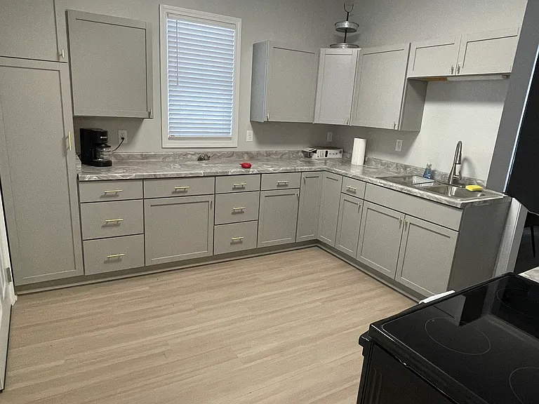 large kitchen with a large pantry and a lot of cabinets
