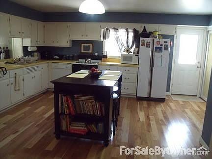 Living Room
						:
						Stained glass front door and many windows for natural light.