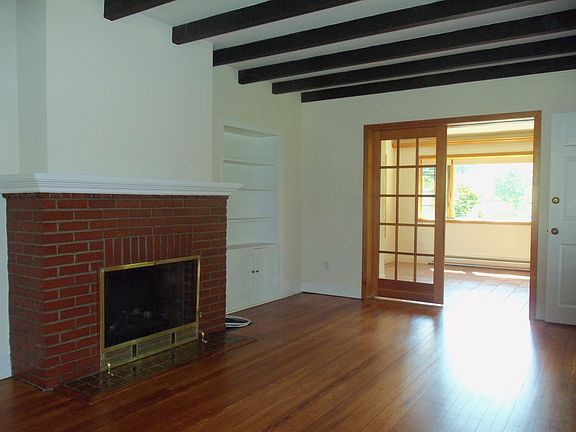 Living room with pocket doors leading to sun room