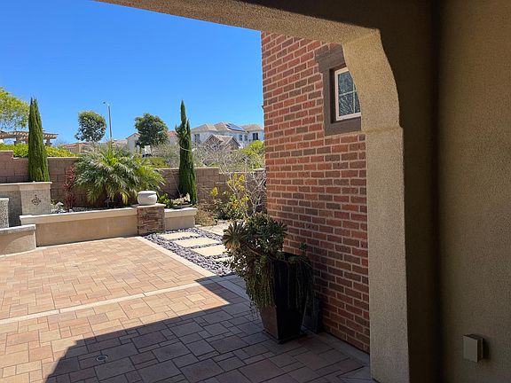 View looking out of hallway leading to the entrance of private studio.