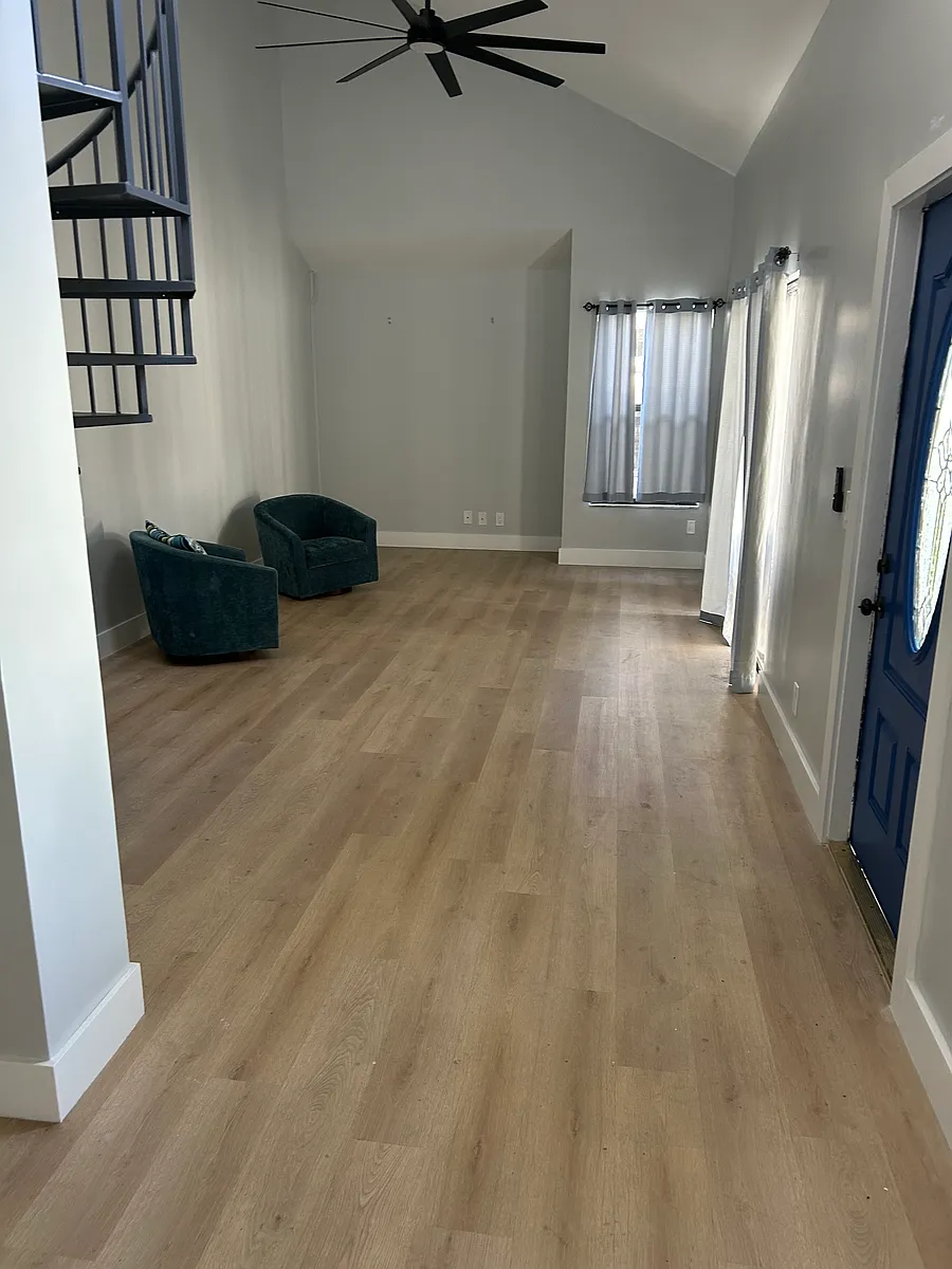 View from dining room of living room. - 1402 Summer Winds Ln