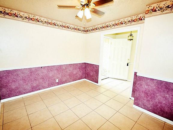 Formal dinning area also has tile floor.