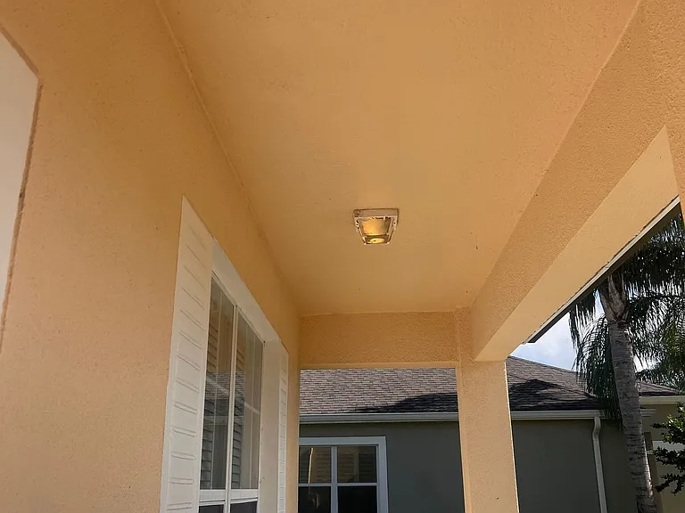 36 - Covered front entry with light fixture.