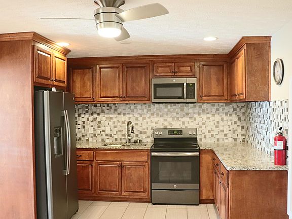 Kitchen, stove and fridge.