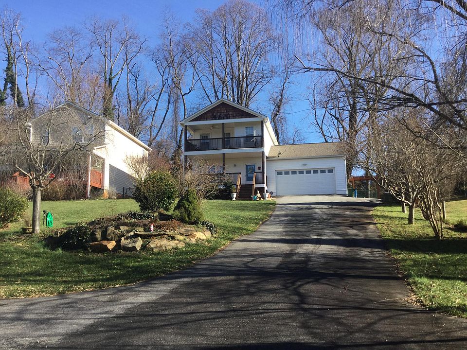 Front of the house with beautiful landscape and ample parking space
