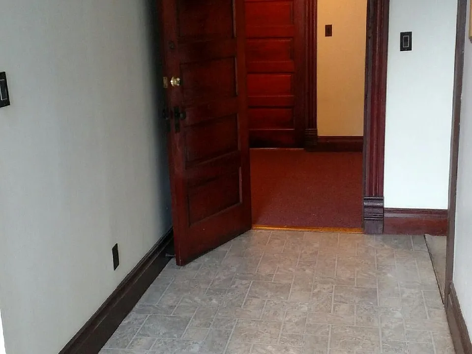 DOOR THAT LEADS TO THE OUTSIDE HALLWAY